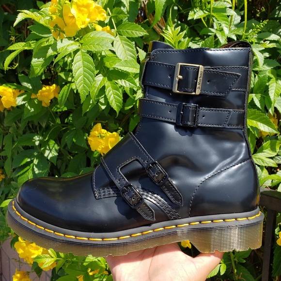black boots with yellow tag